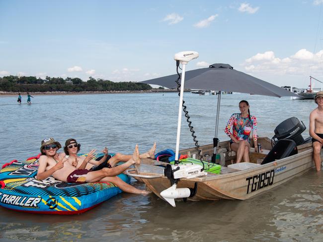 Mackenzie, ky, Johnny and Joel at the Darwin Beer Can Regatta at Mindil Beach, 2024. Picture: Pema Tamang Pakhrin