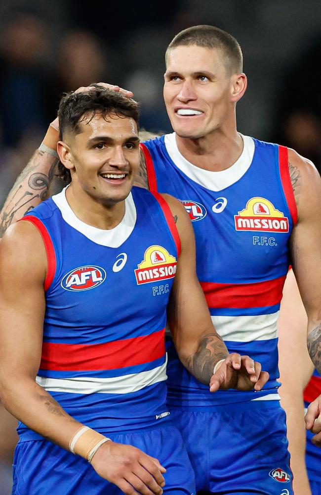 Jamarra Ugle-Hagan with Rory Lobb. Picture: Dylan Burns/AFL Photos via Getty Images.