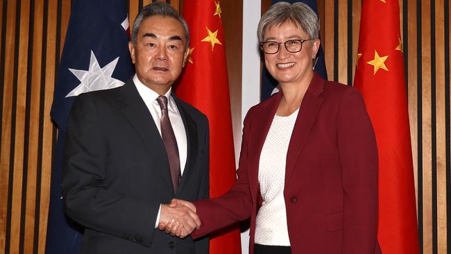 Foreign Minister Penny Wong shakes hands with Chinese Foreign Minister Wang Yi before their bilateral meeting in Canberra. Photo: David Gray / AFP