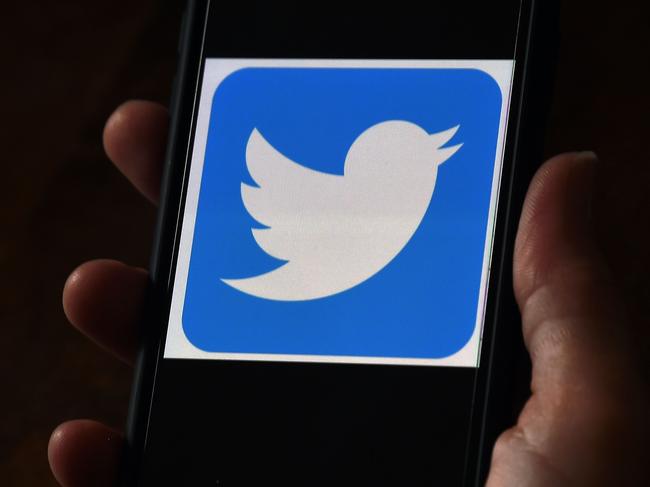 (FILES) In this file photo illustration taken on May 27, 2020, a Twitter logo is displayed on a mobile phone in Arlington, Virginia. - Wall Street was mixed early August 10, 2020, with Nasdaq retreating further as investors digested President Donald Trump's efforts to take unilateral action in the absence of a deal with Congress on emergency pandemic spending. About an hour into the first trading session of the week, the tech-rich Nasdaq was down 0.4 percent to 10,963.75, while the Dow Jones Industrial Average gained 0.95 percent to 27,686.07 and the broad-based S&P 500 rose 0.2 percent to 3,357.96. Twitter gained 1.9 percent amid reports the social media giant held talks to combine with Chinese video app TikTok which Trump last week banned from the US amid what he said were security concerns. (Photo by Olivier DOULIERY / AFP)