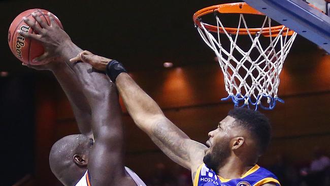 BRISBANE, AUSTRALIA — OCTOBER 13: Nate Jawai of the Cairns Taipans is stopped by Alonzo Gee of the Brisbane Bullets of Brisbane during the round one NBL match between the Brisbane Bullets and the Cairns Taipans at Brisbane Convention &amp; Exhibition Centre on October 13, 2018 in Brisbane, Australia. (Photo by Jono Searle/Getty Images)