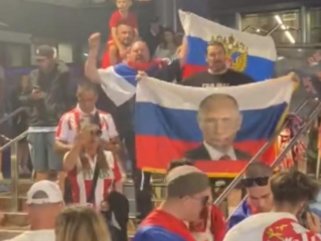 Russian flags featuring the face of Vladimir Putin have been seen at Melbourne Park despite bans.