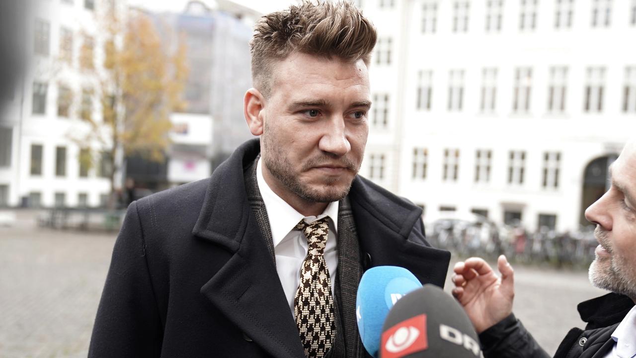 Nicklas Bendtner faces the media as he arrives at court in Copenhagen,.