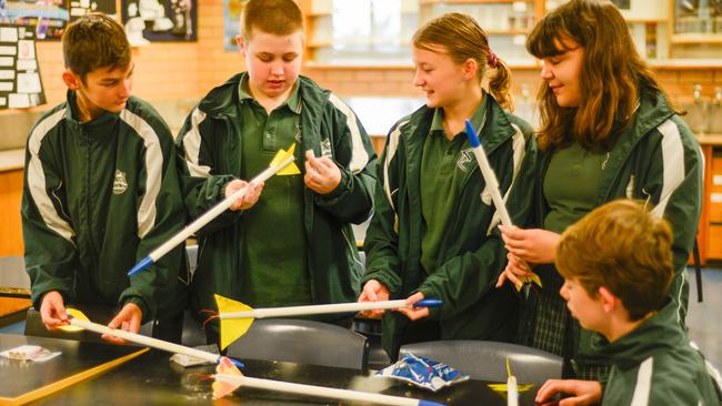 HAVING A BLAST: Year 8 Endeavour STEM class students from L-RCooper, Page, Elanor, Ciara and Sam prepare their rockets for a test flight.