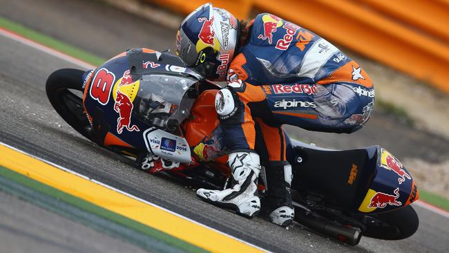 Jack Miller struggles to pick up his bike after his second crash.