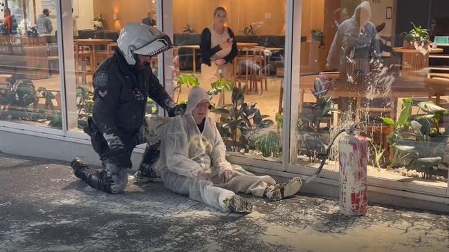 Police arrest an Extinction Rebellion protesters outside the Santos building on Thursday morning. Picture: Supplied