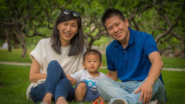 Model citizen Dandan Fan with civil servant husband Xiaojing Zhang and son Ruibao. Picture: Brant Cumming.