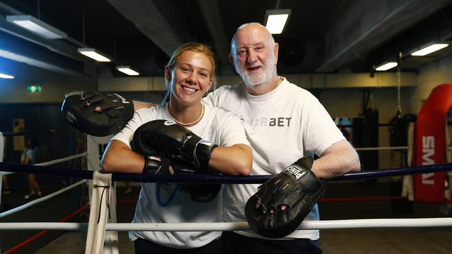 Ella Boot with her trainer Johnny Lewis. Ella is a rising boxing star who moved from Noosa to Sydney just to be trained by legendary trainer Johnny Lewis, who says she will win a world title. Picture: Richard Dobson