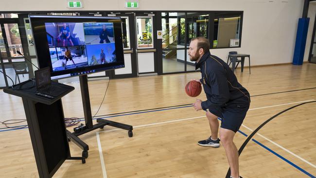 SIGN OF THE TIMES: Grammar First V coach Kabe Cicolini leading his side through an interactive training session in May. Picture: Kevin Farmer