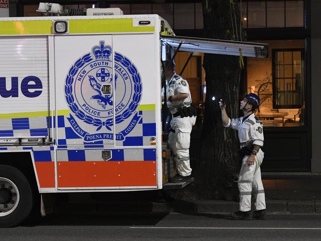 Police set up a crime scene at the hotel. Picture: Gordon McComiskie