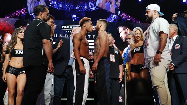 Devin Haney (L) faces off against Vasyl Lomachenko of Ukraine (R).