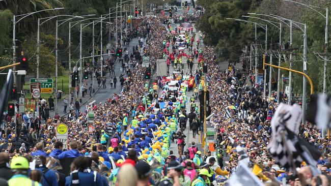 Fans line the streets during the AFL Grand Final Parade in Melbourne. (AAP Image/David Crosling)