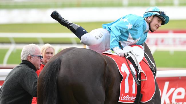 Jamie Kah being legged up by trainer Mick Price at Sandown on Wednesday. Picture: Getty Images