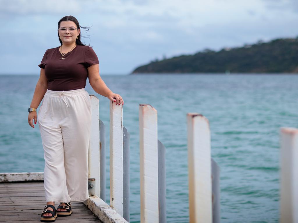 Melbourne, Victoria - January 22, 2025: Pictured on Safety beach. Katie Elson was 26 when her partner noticed a lump in her breast. They thought it was an ingrown hair. A GP said it "doesn't feel too nasty" and told her she was too young to have breast cancer. She was told she could get it checked out but Medicare wouldn't cover it. Katie paid $1000 for a mammogram, ultrasound and biopsy, discovering cancer. She has since had several surgeries including a double mastectomy and reconstruction. Katie later discovered the cancer had spread to her pelvis, and requ ired chemo and radiation. She will be on drugs for life. She is not eligible for PBS support for the drubs because she is too young and doesn't have kids.Her out of pocket costs are well over $50k.Picture: The Australian / Nadir Kinani