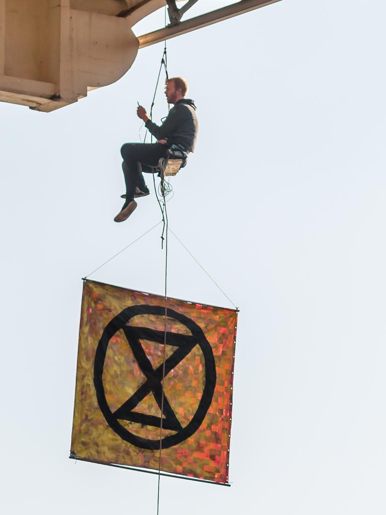 Extinction Rebellion protester abseiling William Jolly Bridge. 19 August 2019. Picture: Supplied.