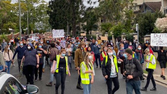 Protesters march towards the Kangaroo Point hotel where 120 asylum seekers are being detained. Picture: 9 News