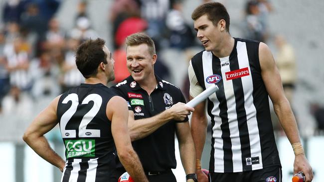 Nathan Buckley has a laugh with Steele Sidebottom and Mason Cox. Picture: Colleen Petch