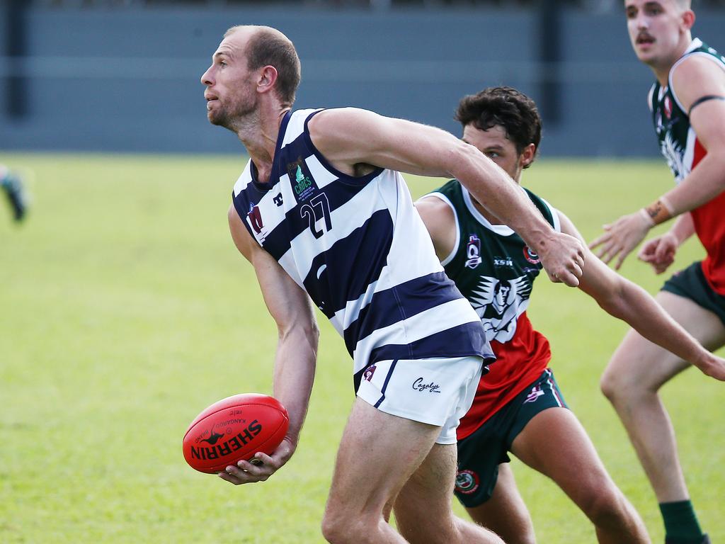 Crocs' David Oates looks to offload but only finds Cutters jerseys in the AFL Cairns Premiership men's match between the South Cairns Cutters and the Port Douglas Crocs, held at Fretwell Park, Bentley Park. Picture: Brendan Radke