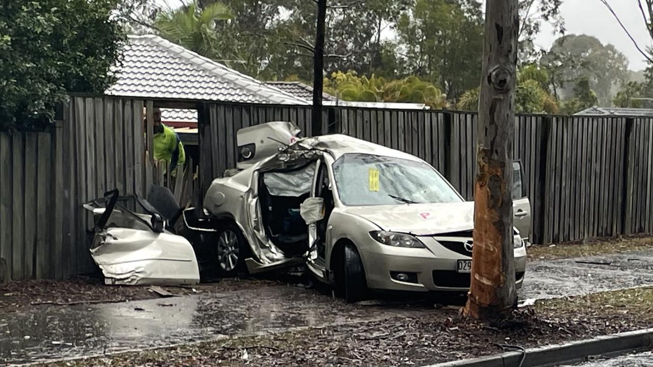 Emergency services were called to Myall Court in Narangba at 1:55pm after a car crashed into a fence, leaving the driver and one passenger trapped inside.