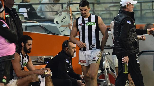 Scott Pendlebury finished Friday’s match on the bench with an ankle injury.