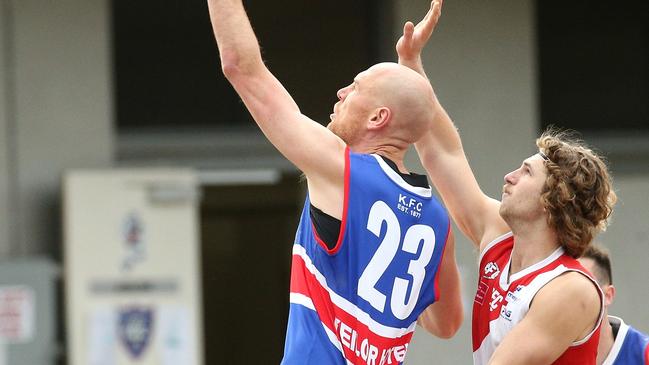 Andrew Browne of Keilor (left) contests ruck against Jack Thorogood of Glenroy. Picture: Hamish Blair