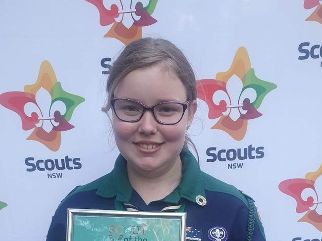 Jacinta showing off a Scouts award