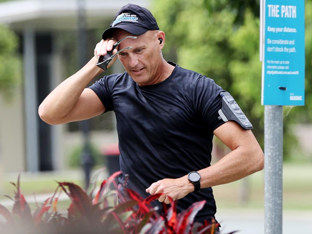 Senior Sergeant Arron Ottaway jogging on the Gold Coast recently. Picture: Nigel Hallett