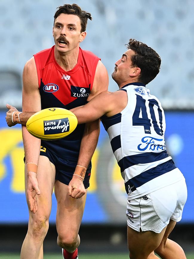 Jake Lever battles against Geelong’s Luke Dahlhaus. Picture: Quinn Rooney/Getty