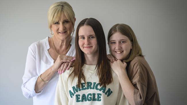 Paris Hedger (centre) pictured with mum Karen and younger sister Charlie. Picture: RoyVphotography