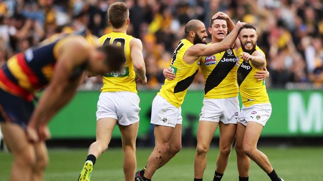 Jason Castagna celebrates a goal with teammates.