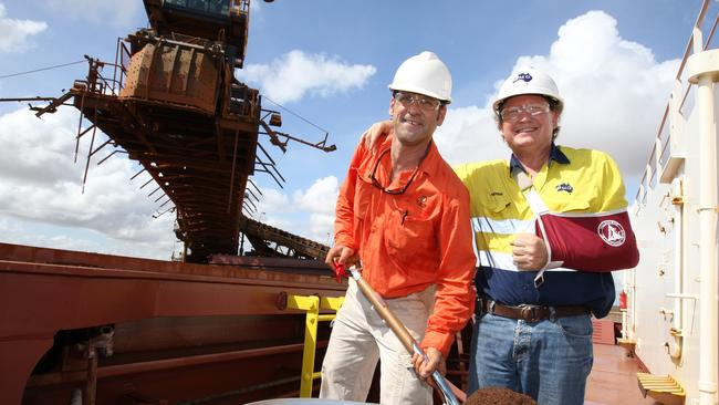 Fortescue’s Andrew Forrest, right, and BC Iron’s Mike Young load iron ore from Nullagine in 2011.