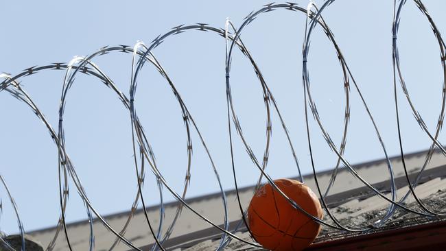 . Balls stuck in the razor wire of the older section of the Bathurst Correctional Centre. Picture: Jonathan Ng