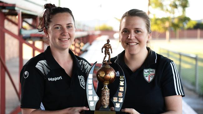 FOOTBALL BUNDABERG: Bingera’s Chenae Briggs and United Park Eagles’s Sarah Bretag with the division one ladies trophy which they will be competing for in tonights clash between Bingera and United Park Eagles.