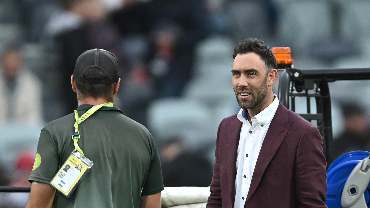 Australian cricketer Glenn Maxwell speaks to the ground staff after play was halted. Picture: Quinn Rooney/Getty Images.