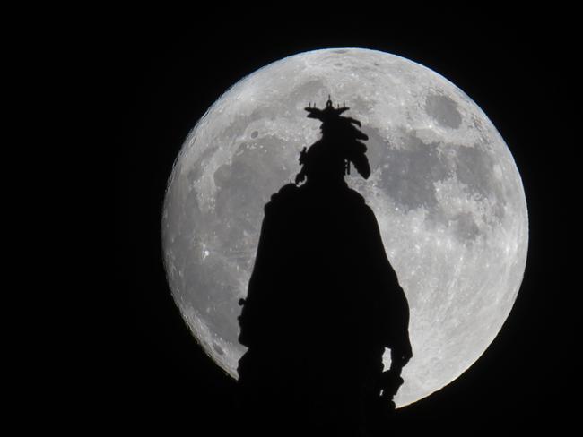 A super moon rises over the Statue of Freedom on the Capitol dome in Washington, DC November 13, 2016. The supermoon will venture to its closest point in 68 years, leaving only 221,524 miles (356,508 km) between Earth and the moon. Picture: AFP PHOTO / Andrew CABALLERO-REYNOLDS