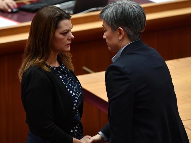 Greens Senator Sarah Hanson-Young thanks Shadow Minister for Foreign Affairs Penny Wong after Greens leader Senator Richard Di Natale makes a statement about behaviour and language in the Senate chamber. Picture: AAP