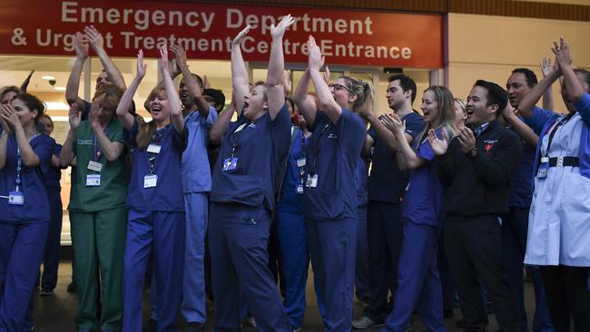 NHS staff applaud outside the Chelsea and Westminster Hospital in London during the weekly "Clap for our Carers". Picture: AP