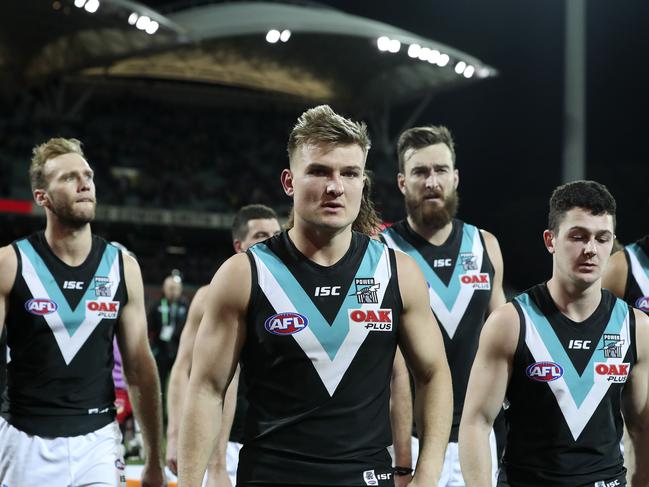 04/08/18 - AFL - Showdown 45 - Adelaide Crows v Port Adelaide at Adelaide Oval. Ollie Wines walks off with team mate after the loss. Picture SARAH REED