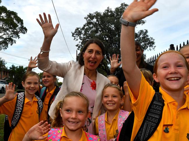 NSW Premier Gladys Berejiklian (centre) interacts with students during a visit to Revesby South Public School. She is running for the seat of Willoughby. Picture: Dean Lewins