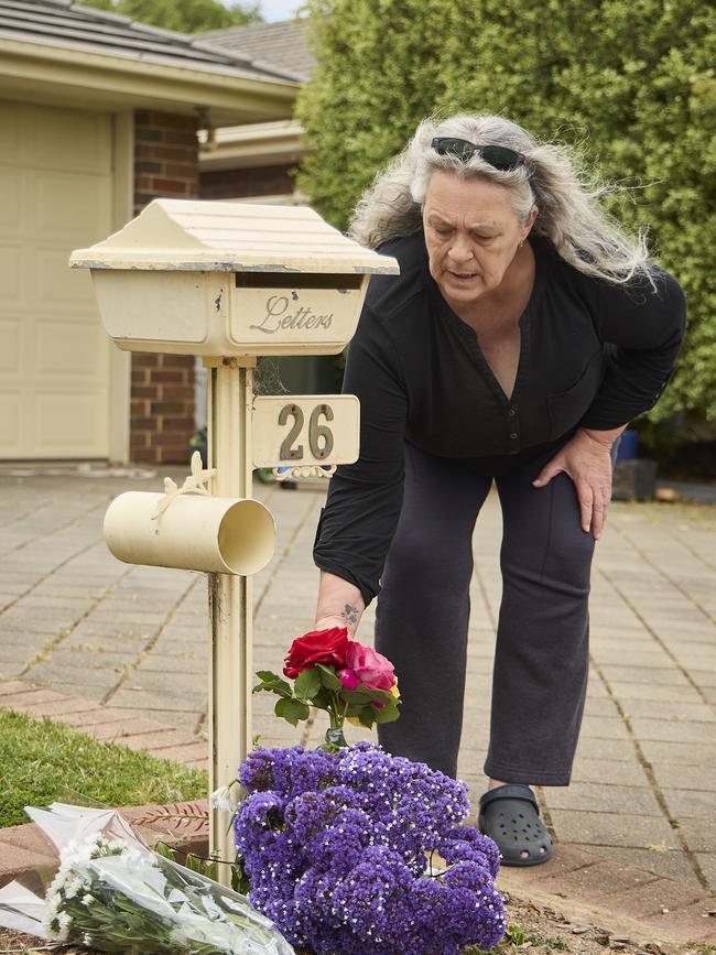 A person leaving flowers outside the home of Krystal Marshall where she was found dead in Aldinga Beach, Sunday, Oct. 22, 2023. Picture: Matt Loxton