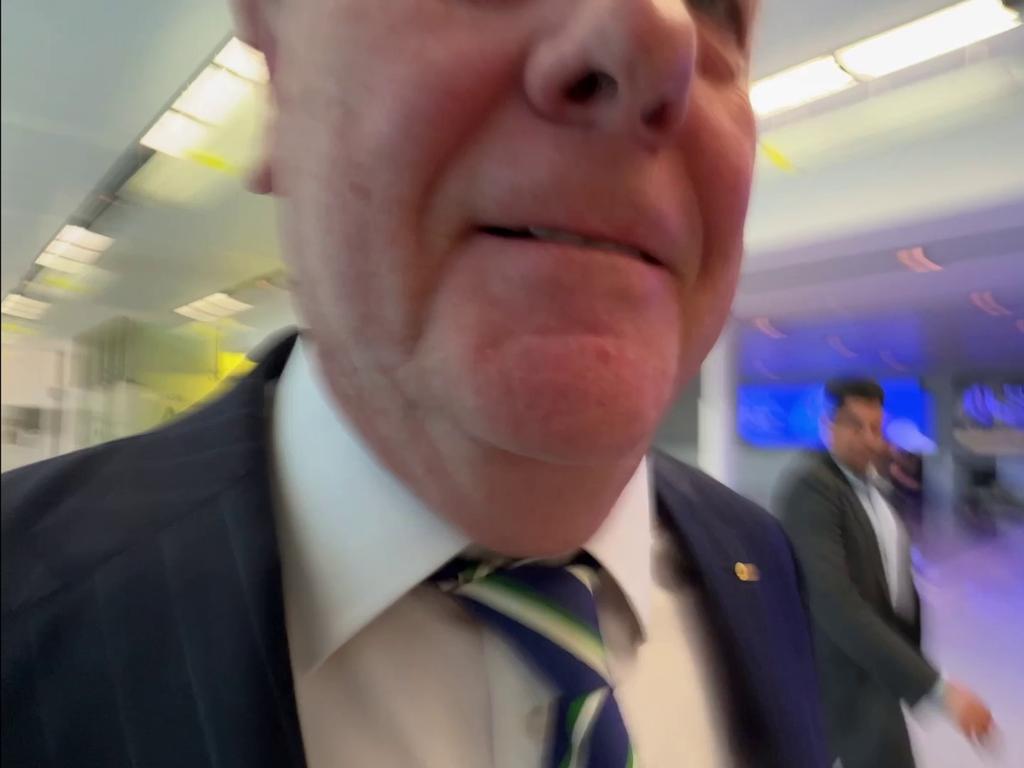 Stills taken from vision of reporter for The Australian, Liam Mendes approaching former Nine chairman Peter Costello at Canberra airport. Picture: Liam Mendes