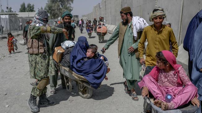 People rush to pass to Pakistan from the Afghanistan border in Spin Boldak. Picture: AFP