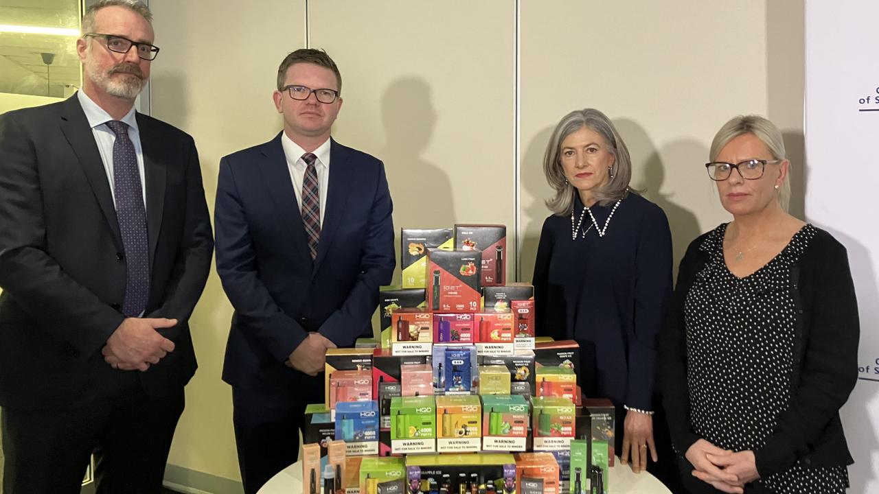 SA Health Protection and Licensing Services Executive Director Chris Lease, Health Minister Chris Picton, Chief Public Health officer Professor Nicola Spurrier and Sara Driver whose 2 teenage daughters became addicted to vapes, in front of seized vapes containing nicotine. Picture Brad Crouch