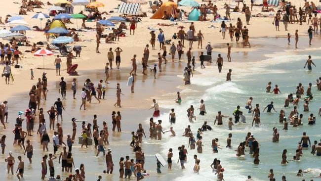 Bondi beachgoers usually revel in cooler conditions on the coast. Not today. Picture: AAP/Glenn Campbell