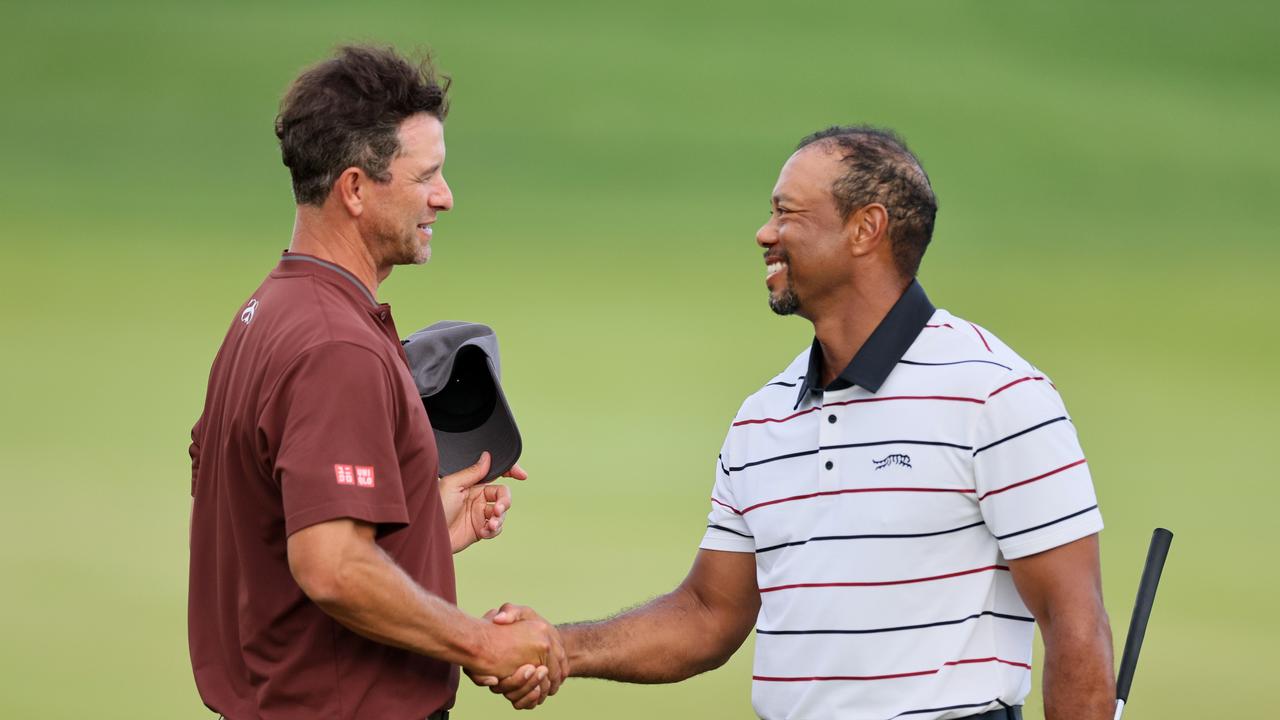 Adam Scott and Tiger shake hands after the second round of the 2024 PGA Championship at Valhalla Golf Club on May 17, 2024. (Photo by Andy Lyons/Getty Images)