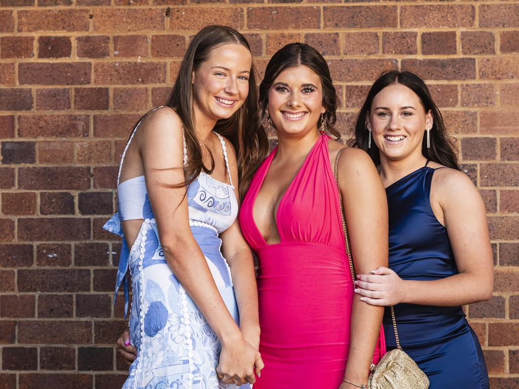 Graduates (from left) Ruby Osmotherly, Georgia Reimers and Bridie Burton as Downlands College year 12 students come together for their valedictory mass at the college, Saturday, November 16, 2024. Picture: Kevin Farmer