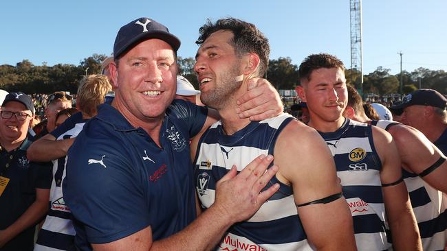 Yarrawonga coach Steve Johnson and captain Leigh Masters after the Pigeons heart-stopping grand final win over Albury. Picture: Yuri Kouzmin