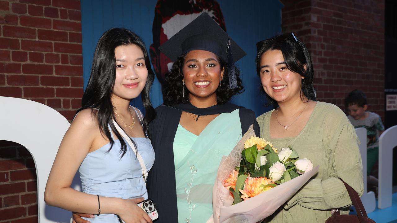 Danielle Ko, graduate Ayomi Goonetilleke and Faith Wong. Picture: Alan Barber