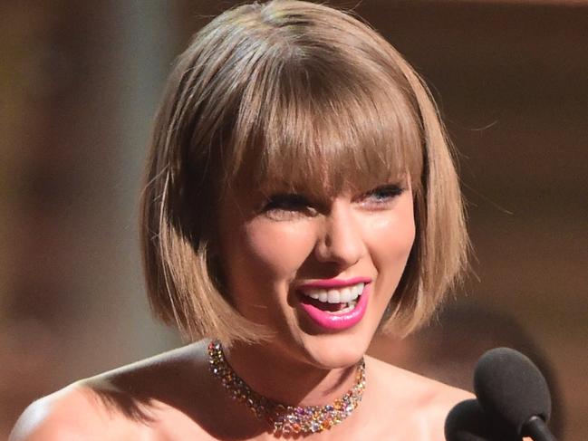 Singer Taylor Swift accepts the award for the Album of the Year onstage during the 58th Annual Grammy music Awards in Los Angeles February 15, 2016. AFP PHOTO/ ROBYN BECK