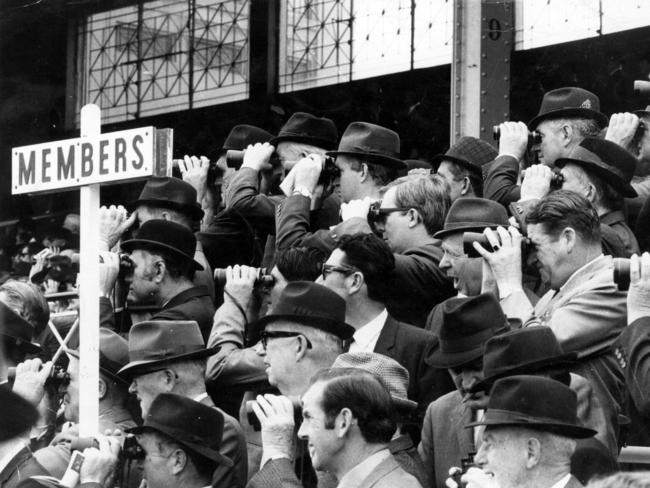 Men watch the race from the members area in 1969.